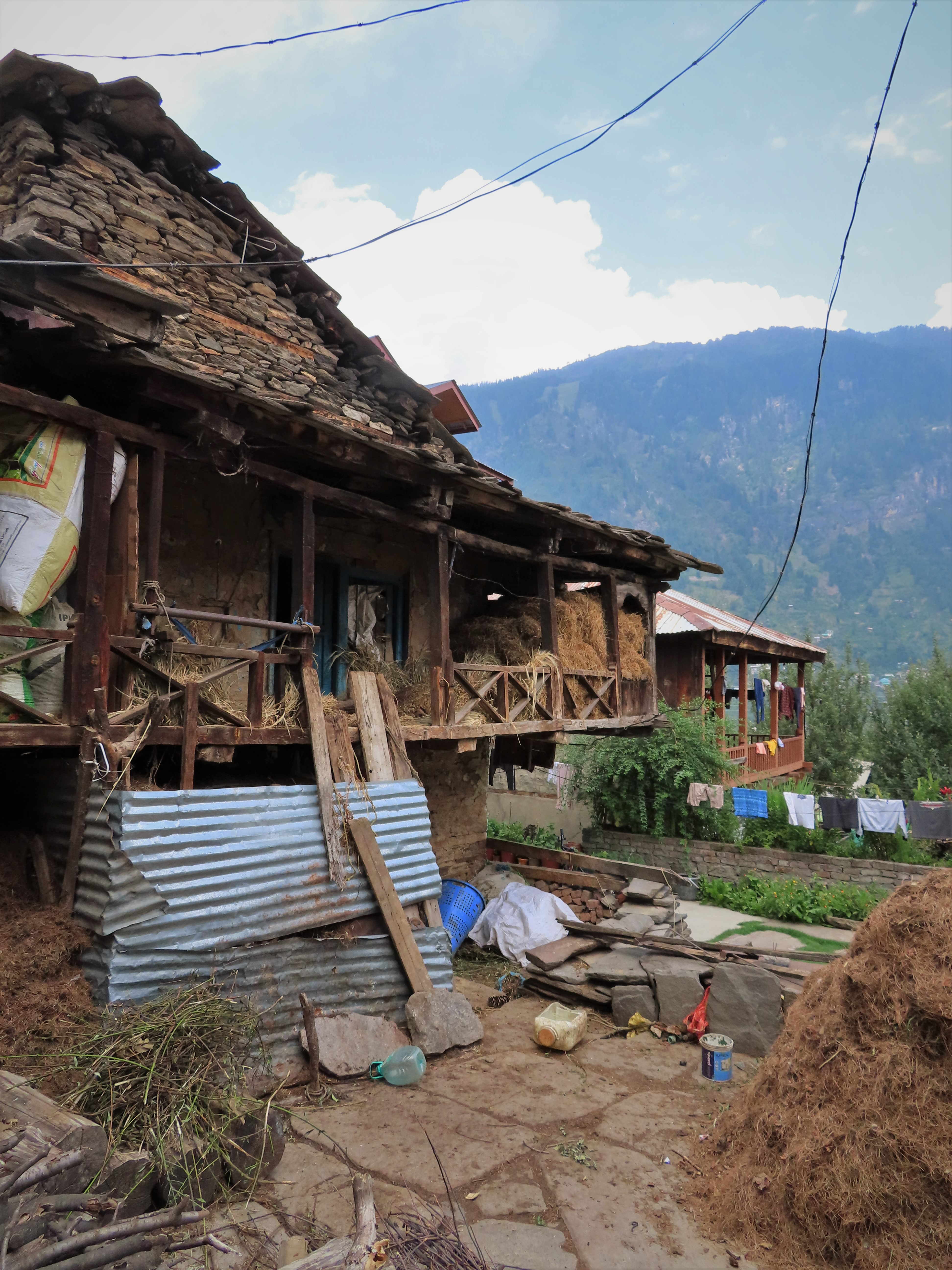 Two traditional wooden houses in Old Manali, India.
