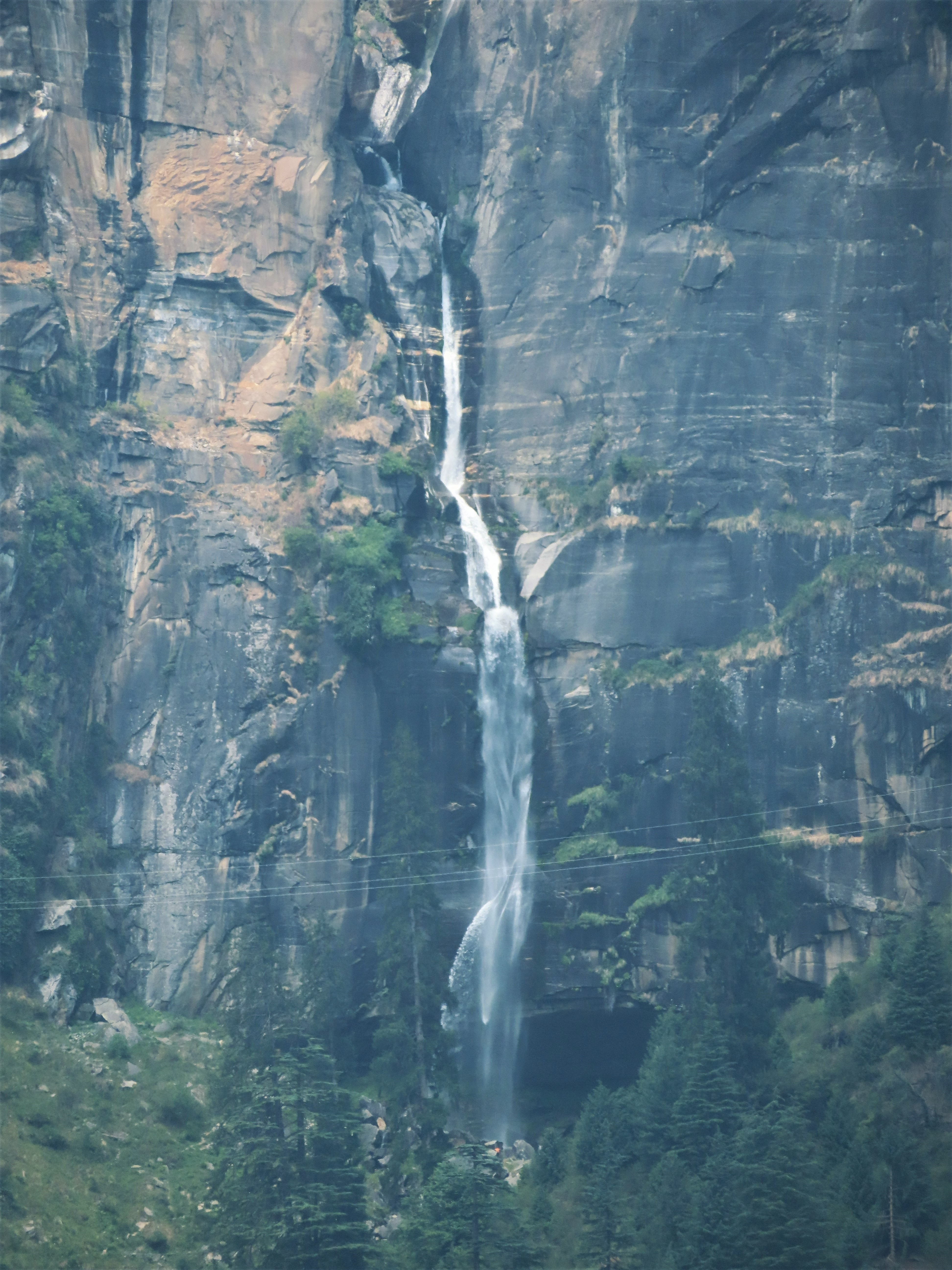 The Jogini Waterfall from afar, near Manali, India.
