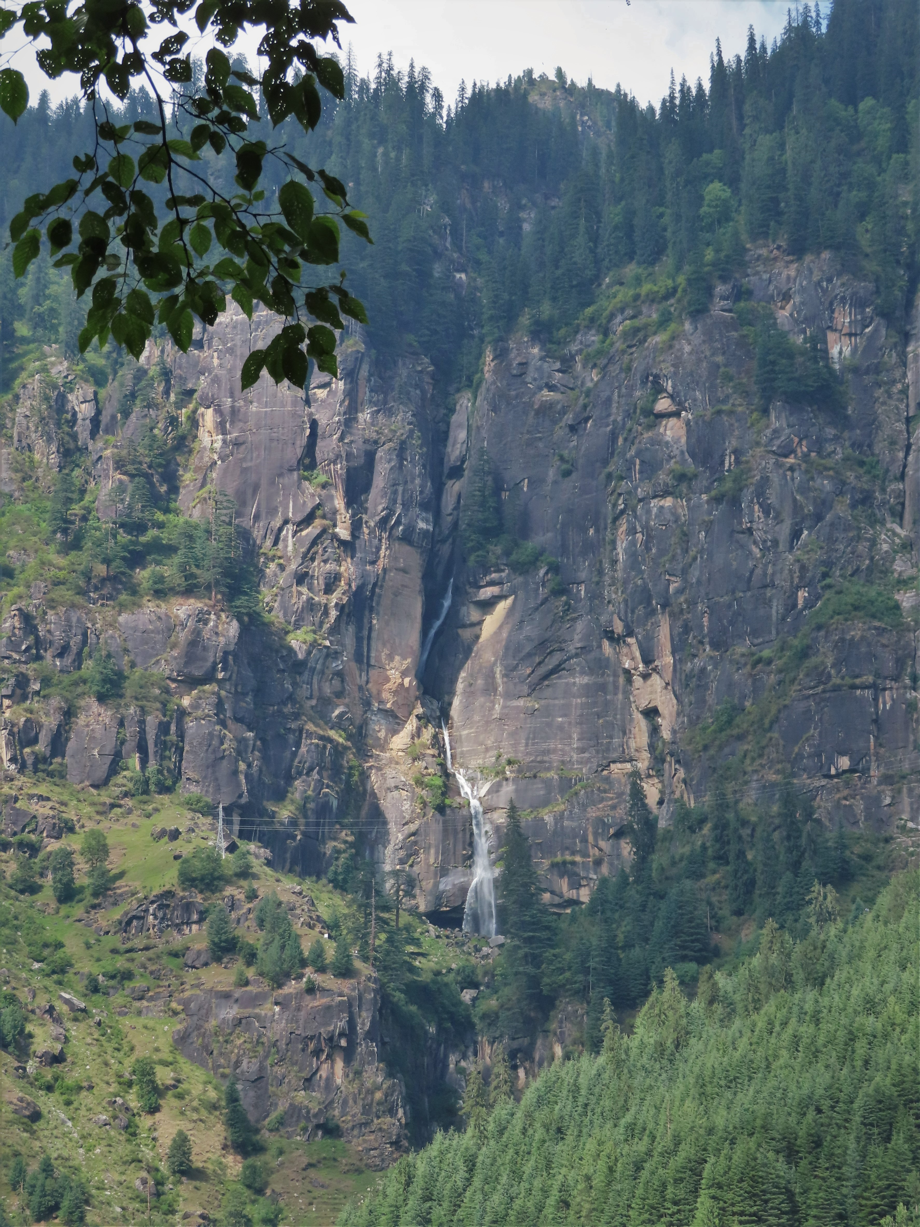 Jogini waterfall from afar near Manali, northern India.